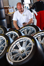 8-February-2013;Australia;Bathurst;Bathurst-12-Hour;Grand-Tourer;Mt-Panorama;NSW;New-South-Wales;atmosphere;auto;endurance;mechanic;motorsport;paddock;portrait;racing;telephoto;tyres;wheels