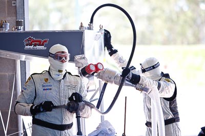 8-February-2013;Australia;Bathurst;Bathurst-12-Hour;Fire-Suit;Grand-Tourer;Mt-Panorama;NSW;New-South-Wales;atmosphere;auto;endurance;fuel-man;fuel-station;mechanics;motorsport;paddock;portrait;racing;telephoto