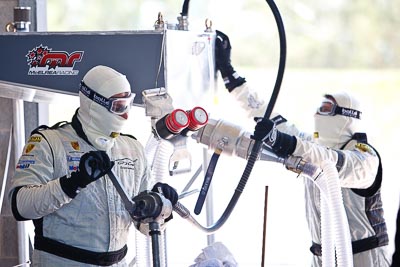 8-February-2013;Australia;Bathurst;Bathurst-12-Hour;Fire-Suit;Grand-Tourer;Mt-Panorama;NSW;New-South-Wales;atmosphere;auto;endurance;fuel-man;fuel-station;mechanics;motorsport;paddock;portrait;racing;telephoto