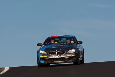 9-February-2013;Australia;BMW-M6;Bathurst;Bathurst-12-Hour;Mt-Panorama;NSW;New-South-Wales;auto;endurance;motorsport;officials;racing;sky;super-telephoto