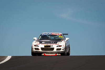 35;35;9-February-2013;Andrew-Bollom;Australia;Bathurst;Bathurst-12-Hour;Grand-Tourer;James-Parish;Mazda-RX‒7;Mazda-RX7;Mt-Panorama;NSW;New-South-Wales;Ric-Shaw;Ric-Shaw-Racing;Stephen-Borness;auto;endurance;motorsport;racing;sky;super-telephoto