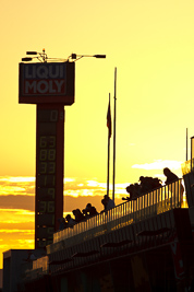 10-February-2013;Australia;Bathurst;Bathurst-12-Hour;Grand-Tourer;Mt-Panorama;NSW;New-South-Wales;atmosphere;auto;backlight;building;endurance;fans;morning;motorsport;pitlane;racing;spectators;sun;sunrise;super-telephoto;tower