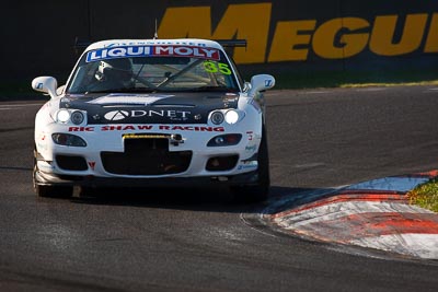 35;10-February-2013;35;Andrew-Bollom;Australia;Bathurst;Bathurst-12-Hour;Grand-Tourer;James-Parish;Mazda-RX‒7;Mazda-RX7;Mt-Panorama;Murrays-Corner;NSW;New-South-Wales;Ric-Shaw;Ric-Shaw-Racing;Stephen-Borness;auto;endurance;motorsport;racing;super-telephoto