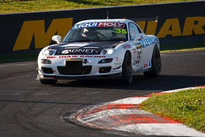 35;10-February-2013;35;Andrew-Bollom;Australia;Bathurst;Bathurst-12-Hour;Grand-Tourer;James-Parish;Mazda-RX‒7;Mazda-RX7;Mt-Panorama;Murrays-Corner;NSW;New-South-Wales;Ric-Shaw;Ric-Shaw-Racing;Stephen-Borness;auto;endurance;motorsport;racing;super-telephoto