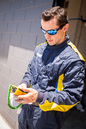 28mm;9-February-2014;Australia;Bathurst;Bathurst-12-Hour;Michelin;NSW;New-South-Wales;atmosphere;auto;endurance;motorsport;pitlane;portrait;racing;technician