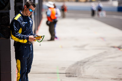 9-February-2014;Australia;Bathurst;Bathurst-12-Hour;Michelin;NSW;New-South-Wales;Topshot;atmosphere;auto;endurance;motorsport;pitlane;portrait;racing;technician;telephoto