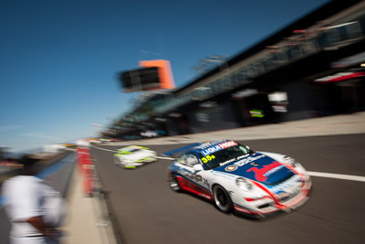 35;35;9-February-2014;Aaron-Zerefos;Andrew-Fisher;Australia;Bathurst;Bathurst-12-Hour;Indiran-Padayachee;NSW;New-South-Wales;Porsche-997-GT3-Cup;Ric-Shaw;SennheiserRentcorp-ForkliftsFiji-Water;auto;endurance;motion-blur;motorsport;racing;wide-angle